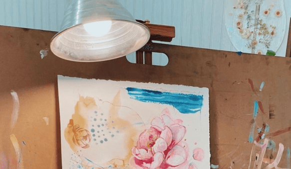 clamp light above paper painting